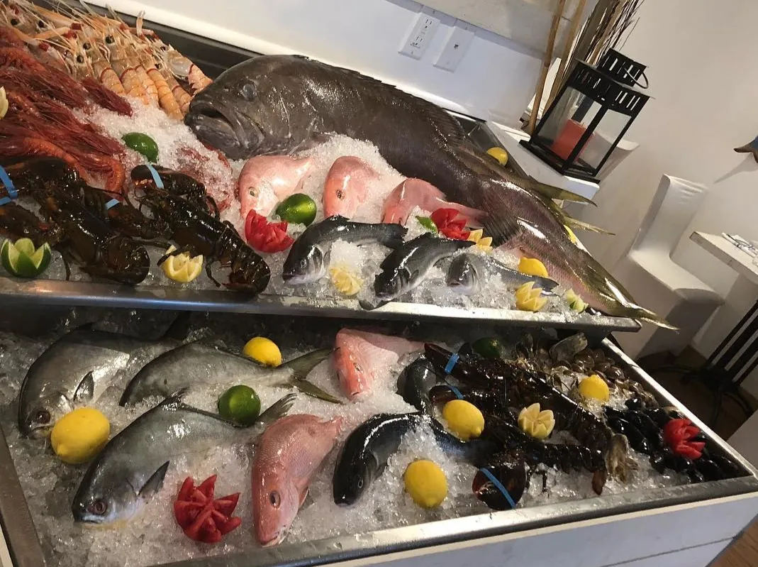 Fish, prawns and lobster on ice in the display at La Pescheria